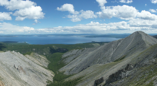 Panoramic view of Lake Khövsgöl in northern Mongolia, from the mountains to the west of the lake, on July 23rd, 2005. Original here. (Wikimedia user Zoharby/CC BY-SA).