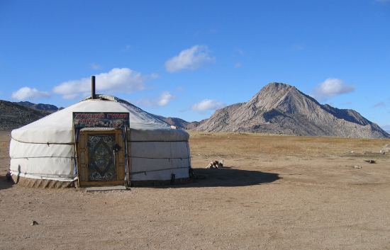 A Mongolian ger, with a sign that says (roughly) "Food, Fast food restaurant, General store", seen on October 10th, 2006. Original here. (Bouette/CC BY-SA).