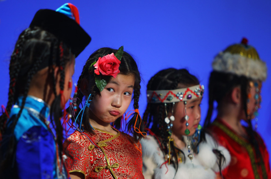 Girls in a Mongol children's chorus perform on August 26, 2009 in Hulun Buir, Inner Mongolia Autonomous Region, China. (Feng Li/Getty Images).